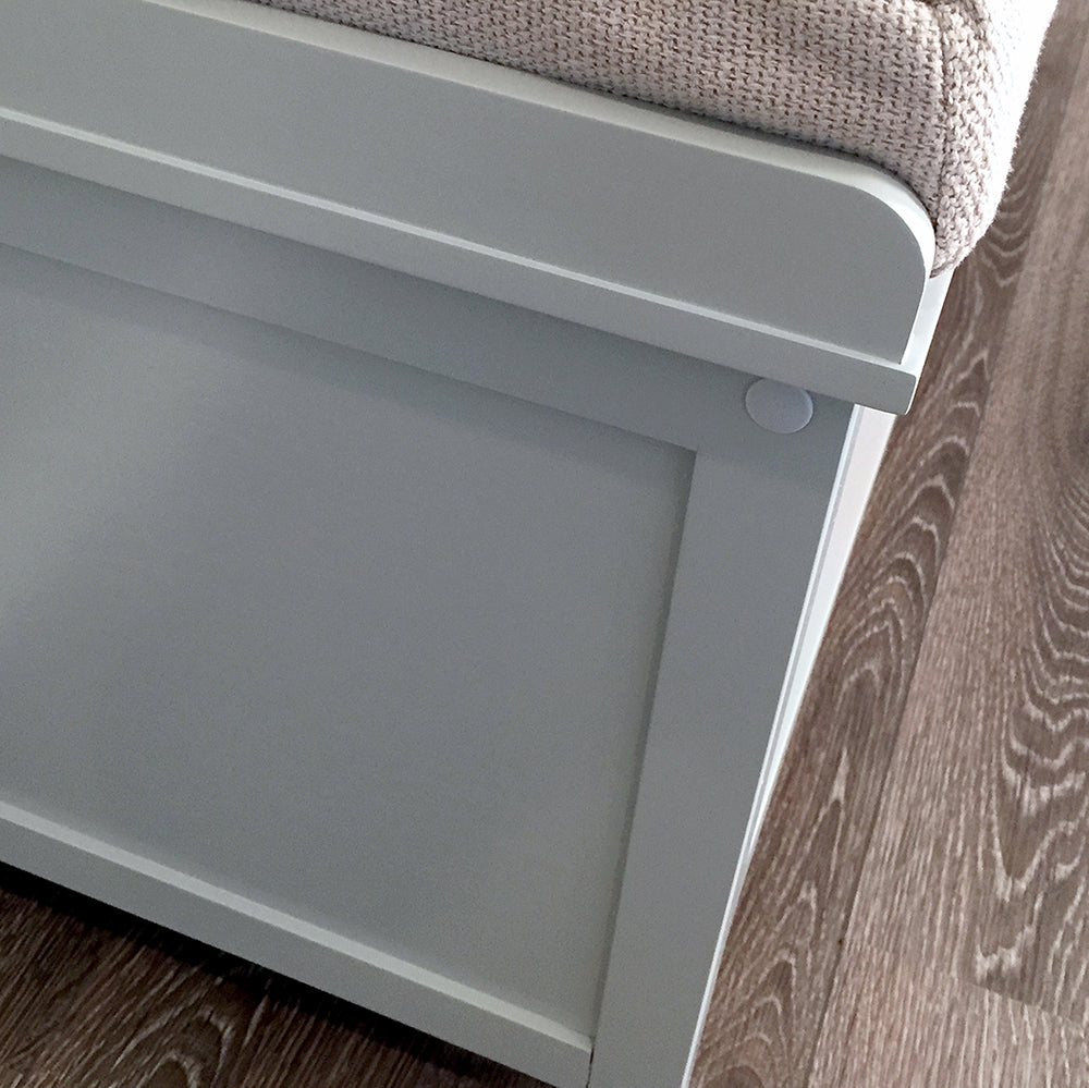 closeup of side details of a grey shoe bench