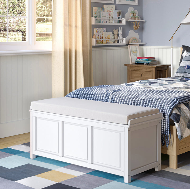 white storage bench at end of bed in Childs bedroom